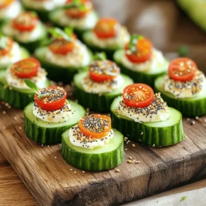 - 1 large cucumber - 8 oz cream cheese, softened - 1 tablespoon sour cream - 1 tablespoon fresh dill, chopped - 1 teaspoon garlic powder - 1 teaspoon onion powder - 2 teaspoons sesame seeds - 2 teaspoons poppy seeds - 1 teaspoon dried minced onion - Salt and black pepper to taste - Cherry tomatoes, halved (for garnish) Using fresh ingredients is key for great flavor. Fresh cucumbers add crunch and moisture. Cream cheese should be soft for easy spreading. Fresh dill gives a bright taste. When you use fresh items, your Everything Bagel Cucumber Bites will shine. They will taste better and look more appealing. If you need substitutes, don’t worry. You can swap the cream cheese for Greek yogurt for a lighter option. If you don’t have fresh dill, dried dill works too. You can also use any herbs you like. Don't have sesame seeds? Try sunflower seeds instead. These changes keep your bites tasty and fun! Start by washing the cucumber well under cold water. This helps remove dirt and bacteria. Next, cut it into rounds that are about ½-inch thick. Each slice should be a good size for your bites. After slicing, use a paper towel to pat each slice dry. Removing excess moisture is key. It keeps your bites from getting soggy. In a medium bowl, combine the softened cream cheese with sour cream. Add finely chopped dill, garlic powder, and onion powder. Don't forget a pinch of salt and pepper for taste. Mix these ingredients with a spatula or a mixer. You want a smooth and creamy texture. This mixture packs a lot of flavor. Take a cucumber slice and spread a generous layer of the cream cheese mixture on top. Make sure to cover it well for the best taste. Now, sprinkle the everything bagel seasoning over the cream cheese. This includes sesame seeds, poppy seeds, and dried minced onion. Press lightly so it sticks. Finally, place half of a cherry tomato on each bite. This adds color and freshness. Serve these bites right away for the best experience! To keep your cucumber bites crisp, choose firm cucumbers. Wash them well and slice them just before serving. After slicing, pat each piece dry with a paper towel. This will remove extra moisture. Moisture can make them soggy. If you can, serve them right after you make them. For smooth spreading, use softened cream cheese. Mix it with sour cream and spices in a bowl. A spatula works well for this. Spread the cream cheese thickly on the cucumber. Make sure to cover the entire slice. This adds flavor and helps the toppings stick. For a great look, arrange the bites on a colorful platter. You can add fresh herbs around them. This adds color and makes the dish pop. Placing a cherry tomato half on each bite adds a splash of red. It also gives extra taste. Remember, a beautiful display makes your food more appealing! {{image_4}} You can add many toppings to your cucumber bites. Try smoked salmon for a rich taste. A slice of radish adds a nice crunch. Crumbled feta cheese gives a salty kick. You can even add a slice of avocado for creaminess. Mixing and matching toppings keeps things fun! You don't have to stick with plain cream cheese. Flavored cream cheeses can change the game! Try chive or herb cream cheese for added zest. A spicy jalapeño cream cheese adds heat. For a sweet twist, use a honey-infused cream cheese. Each flavor will give your bites a unique taste. If you're vegan or lactose intolerant, don't worry! You can use dairy-free cream cheese instead. Cashew cream or hummus works well too. These options keep the bites tasty and creamy. You can even mix in some nutritional yeast for a cheesy flavor. Everyone can enjoy these delightful snacks! Store leftover cucumber bites in an airtight container. Layer them with parchment paper to keep them from sticking together. Place the container in the fridge right away. They will stay fresh for up to two days. To keep the bites crisp, do not add cherry tomatoes until you serve them. The tomatoes can release moisture and make the bites soggy. If you know you will have leftovers, prepare the cucumber and cheese mix separately. Assemble them just before serving for the best texture. These cucumber bites are best served cold, so there's no need to reheat them. If you want to serve them warm, you can gently heat the cream cheese mixture. Just be careful not to melt it too much. When serving, add fresh herbs or extra seasoning for a pop of flavor. Yes, you can make these bites ahead of time. Prepare the cucumber and cream cheese mix. Chill them in the fridge for a few hours. Just add the toppings before serving for the best taste. This way, they stay fresh and tasty. These cucumber bites pair well with many snacks. Try serving them with veggie sticks or crackers. Hummus or a light dip can also be a great choice. For drinks, sparkling water or light cocktails work nicely. You can mix and match to suit your guests' tastes! You can easily adjust the seasoning in the cream cheese mix. If you like garlic, add more garlic powder. For a stronger onion flavor, increase the onion powder. If you want it spicy, try adding a pinch of cayenne pepper. Taste and adjust as you go for the best flavor! In this post, we explored everything about making Everything Bagel Cucumber Bites. We covered the importance of fresh ingredients and shared easy substitutes. I provided step-by-step instructions for prep and assembly. Plus, I shared tips on keeping your bites crisp and looking great. Remember, these bites are flexible. You can mix toppings and try different cream cheese flavors. With smart storage tips, you can enjoy them later too. Have fun making these tasty treats, and don’t hesitate to get creative!