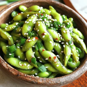 To make Spicy Garlic Edamame, you need simple and tasty ingredients. Here’s what you will need: - 2 cups edamame (in pods) - 4 cloves garlic, finely minced - 2 tablespoons extra virgin olive oil - 1 tablespoon soy sauce - 1 teaspoon red pepper flakes - Sea salt, to taste - 1 teaspoon toasted sesame oil - 1 tablespoon sesame seeds (for garnish) - Chopped green onions (for garnish) These ingredients come together for a quick and satisfying snack. Edamame is high in protein and fiber, making it a healthy choice. Garlic adds a rich flavor, while red pepper flakes bring heat. The olive oil and sesame oil make the dish smooth and tasty. You can easily find these ingredients at any grocery store. When you gather your ingredients, make sure your edamame is fresh. Look for bright green pods without blemishes. This will help your dish look and taste great. If you want a mild snack, use less red pepper flakes. Adjust the spice to fit your taste. This recipe is flexible and perfect for all spice lovers! - Fill a pot with water and add salt. - Bring the water to a boil. - Add edamame pods and cook for 4-5 minutes. Cooking the edamame just right is key. You want them tender but firm. If you overcook them, they lose their bite and flavor. - Drain the cooked edamame in a colander. - Transfer them to a bowl of ice water. Chilling stops the cooking fast. This keeps the bright green color. After a few minutes, drain again and pat dry with a towel. - Heat olive oil in a skillet over medium heat. - Add minced garlic and sauté for 1 minute. - Mix in soy sauce, red pepper flakes, and sesame oil. Sautéing the garlic brings out its sweet flavor. Stir it often to avoid burning. Adding soy sauce and sesame oil gives it depth. - Add the drained edamame to the skillet. - Toss the edamame in the spicy garlic sauce. Mix them well to coat every pod. Sauté for an additional 2-3 minutes until heated through. - Sprinkle sea salt to taste. - Plate the edamame and garnish with sesame seeds and chopped green onions. The final touch adds color and crunch. The sesame seeds and green onions make the dish pop. Enjoy your spicy garlic edamame! When picking edamame, look for bright green pods. They should be firm and plump. Avoid any that have brown spots or wrinkles. Fresh edamame has a sweet taste and vibrant color that makes your dish pop. Always choose the best quality for great flavor. If you want to change the spice, start with less red pepper flakes. Add more if needed after cooking. This way, you can make the dish milder or hotter, depending on your taste. Remember, a little goes a long way. You can also try other spices for a twist! Be careful not to burn the garlic. Keep the heat at medium and stir it constantly. Garlic cooks fast and can turn bitter if it burns. For the edamame, don’t overcook them. They should be tender but still firm. This keeps them bright and tasty! {{image_4}} You can turn your Spicy Garlic Edamame into a heartier snack by adding protein. Shrimp or chicken works well. Simply sauté the shrimp in olive oil until they are pink and cooked through. For chicken, use small, bite-sized pieces. Cook them until golden brown before adding the garlic and sauce. This addition makes the dish more filling. If you want a vegan twist, try using different seasonings. Instead of soy sauce, you can use tamari for a gluten-free option. You can also sprinkle nutritional yeast on top for a cheesy flavor. Add some roasted chickpeas for extra protein and crunch. These swaps keep the dish plant-based while still bursting with flavor. To give your edamame a fresh twist, add extra herbs or citrus zest. Fresh cilantro or basil can brighten up the dish. A splash of lime or lemon juice at the end adds a tangy kick. You can even try a sprinkle of smoked paprika for a smoky flavor. These enhancements make your snack even more exciting and tasty! To keep your Spicy Garlic Edamame fresh, cool them completely first. Place the edamame in an airtight container. Store them in the fridge for up to three days. Make sure to seal the container well. This helps stop moisture and keeps the flavor strong. If you want to save some for later, freezing is a great option. First, cool the cooked edamame in ice water, then drain them well. Spread them on a baking sheet in a single layer. Freeze for about two hours until they are solid. Once frozen, transfer them to a freezer bag. They will stay fresh for up to three months. When you’re ready to enjoy your edamame again, there are two easy methods. For the stovetop, heat a little olive oil in a skillet over medium heat. Add the frozen edamame and sauté for about five minutes. Stir often to heat them evenly. For the microwave, place the edamame in a bowl with a splash of water. Cover and heat for two to three minutes. This keeps them tasty and warm without losing flavor. Yes, you can make Spicy Garlic Edamame ahead of time. Cook the edamame and prepare the sauce. Store them separately in airtight containers in the fridge. You can keep them for about 3 days. When you are ready to serve, just reheat the edamame in a pan for a few minutes. This will help keep the flavors fresh. Spicy Garlic Edamame pairs well with many dishes. Here are some ideas: - Sushi rolls - Rice bowls - Stir-fries - Grilled meats - Noodle dishes You can also serve it as a snack with drinks or as an appetizer at parties. Yes, Spicy Garlic Edamame is healthy. Edamame is rich in protein, fiber, and vitamins. Each serving provides essential nutrients. They are low in calories and fat. Garlic adds health benefits, too. It can boost your immune system and may lower blood pressure. This dish is a great choice for a healthy snack or side. You’ve learned how to make Spicy Garlic Edamame, from ingredients to storage. We covered tips for fresh pods and adjusting spice levels. Try adding shrimp for protein or different herbs for flavor. Remember, these snacks are easy to store and reheat. Enjoy your tasty, healthy treat! Your culinary skills will shine with this simple recipe.